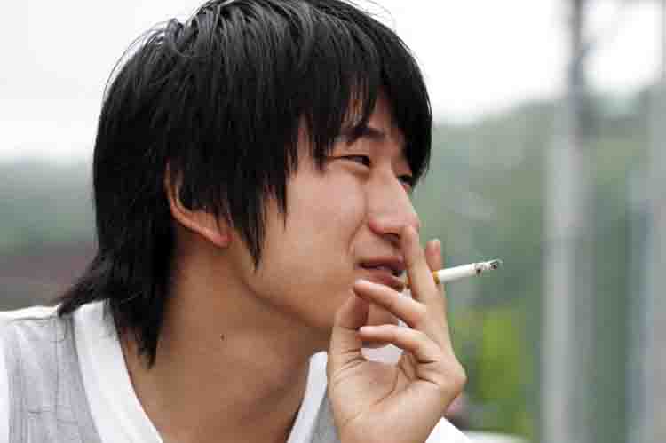 asian man smoking